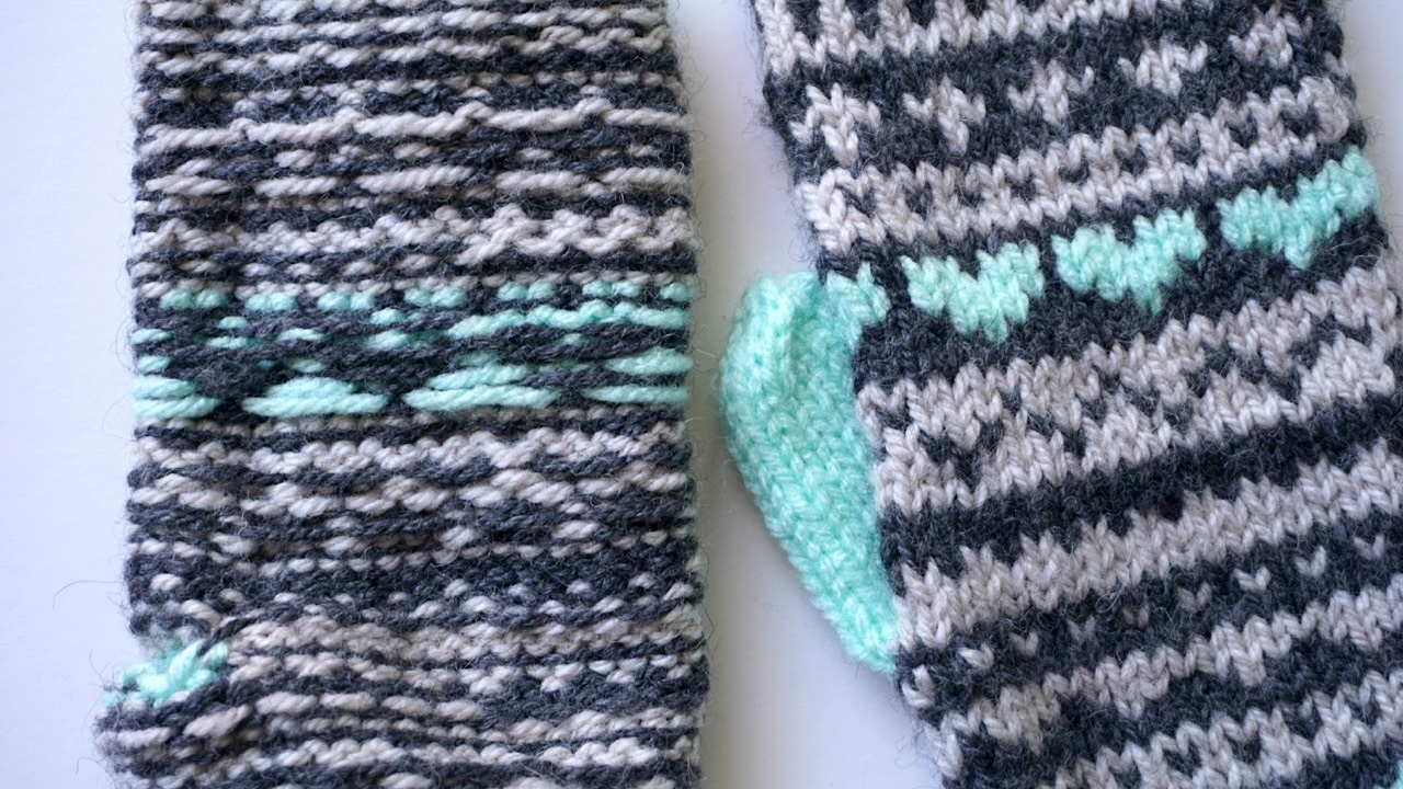 Close-up of colorwork mittens showing the wrong side and the right side