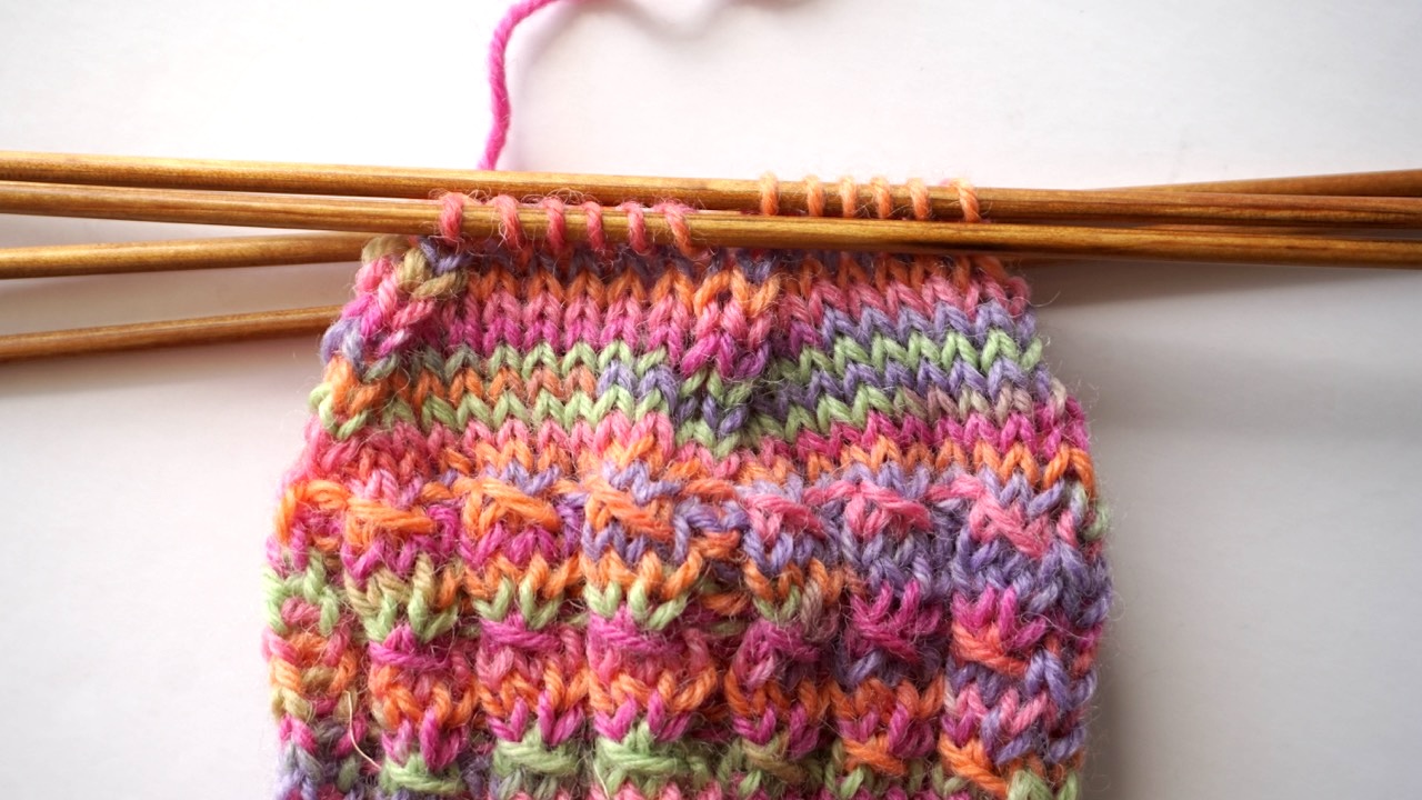 Step-by-step knitting photo showing the decreases of the star toe